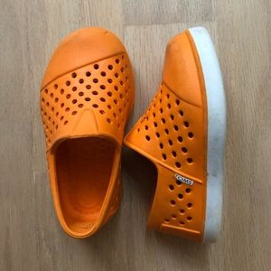 Orange TOMS rubber water shoes - size 5